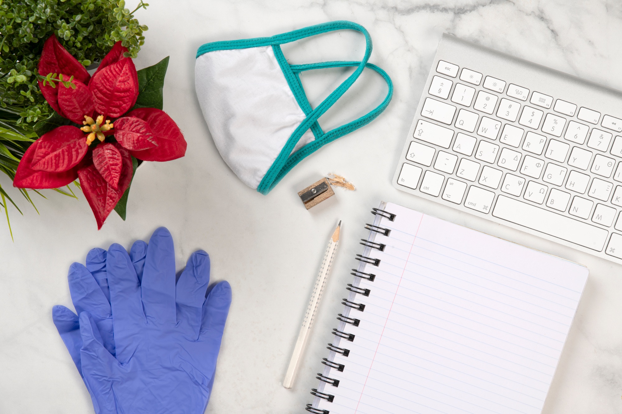 Doctors desk with protection face mask and gloves against the corona virus
