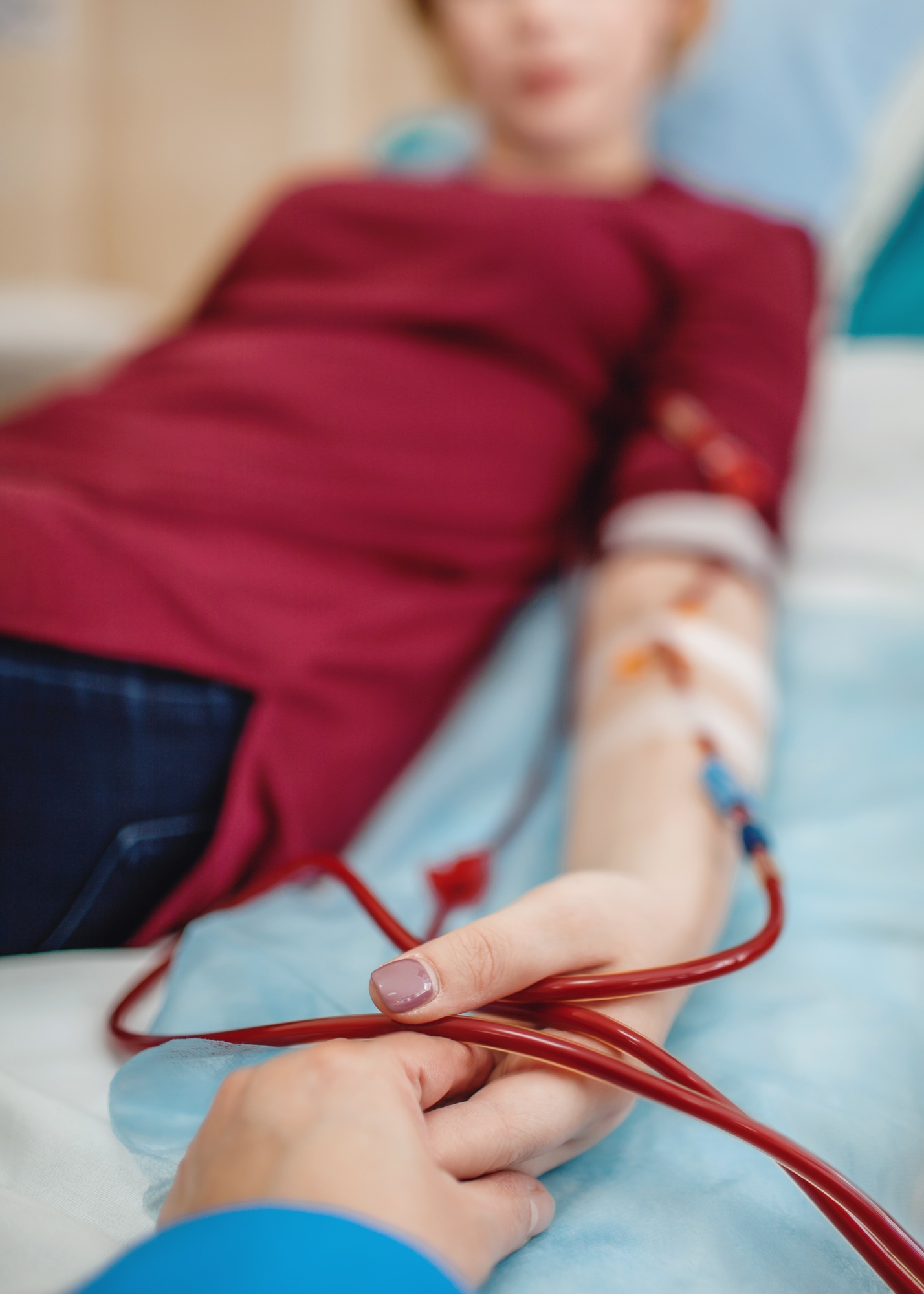 Young girl on hemodialysis in hospital, dialysis system equipment, kidney disease chronic patient